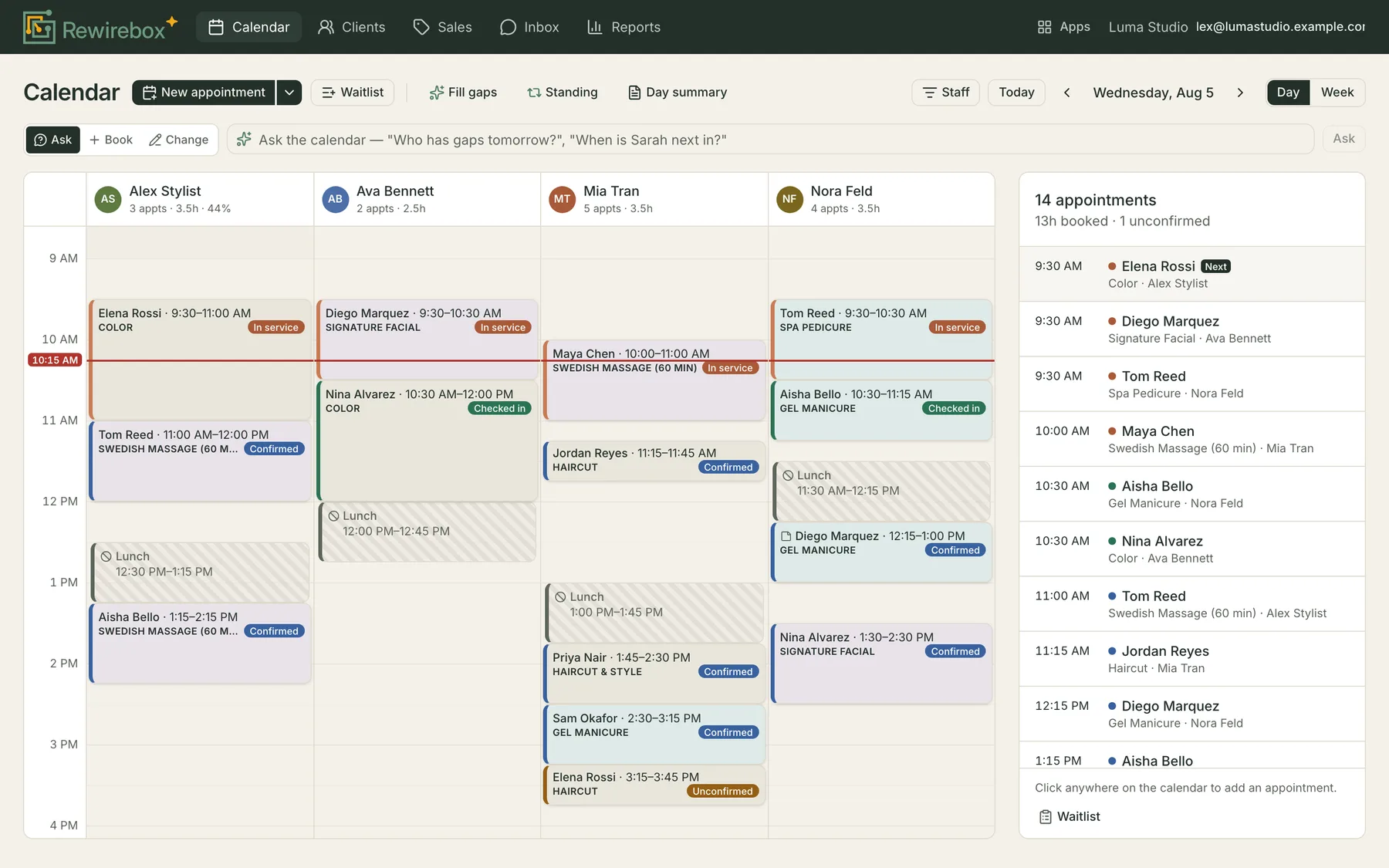 The calendar in day view — a column for each working stylist, time running down the left, and a red line marking the current time.