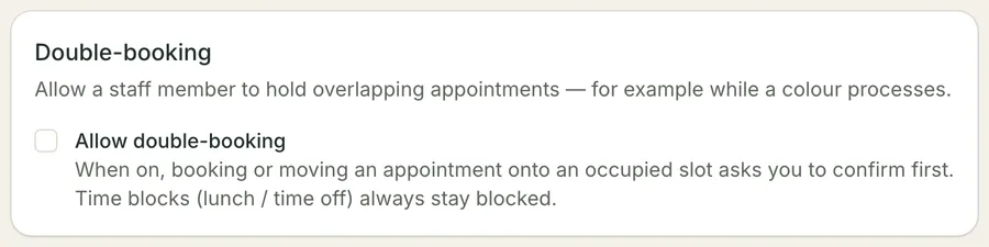 The Double-booking card in Calendar settings: a checkbox reading Allow double-booking, above a line explaining that booking onto an occupied slot then asks you to confirm first, and that time blocks stay blocked either way.