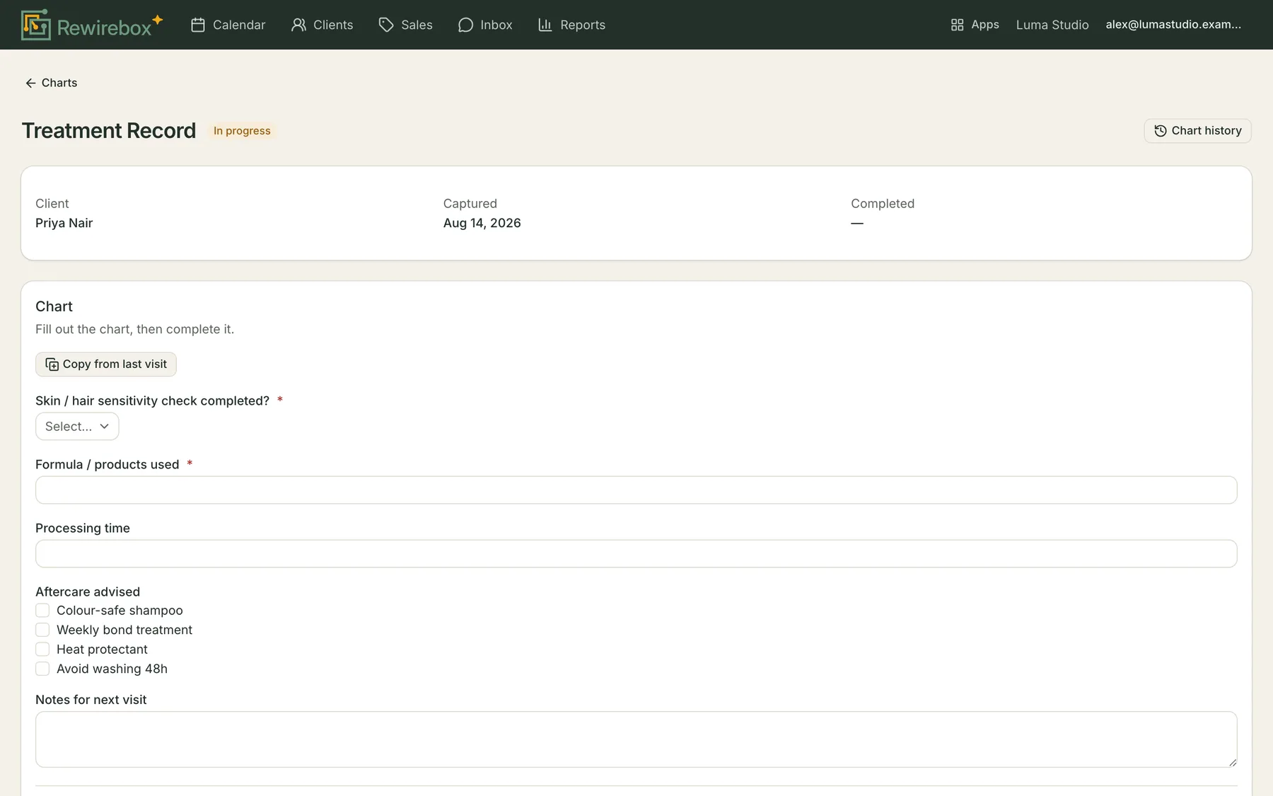 An in-progress chart open for filling in: the client and capture date above a form where every template field is an input — a dropdown, two text boxes, a checkbox list and a notes box — with Copy from last visit at the top.