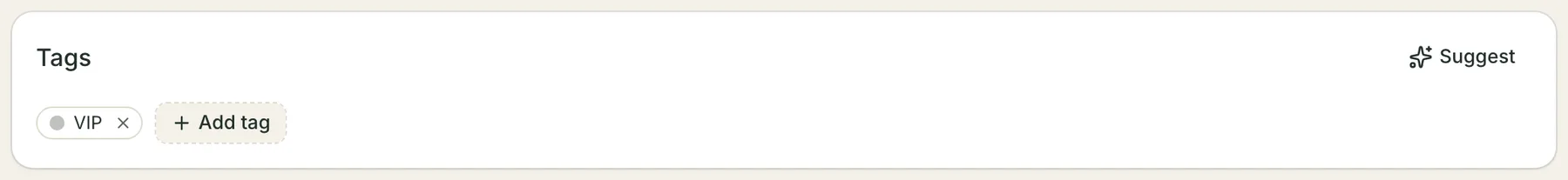 The Tags card on a client record: a VIP chip with a remove cross, a dashed Add tag button beside it, and a Suggest button in the card's header.