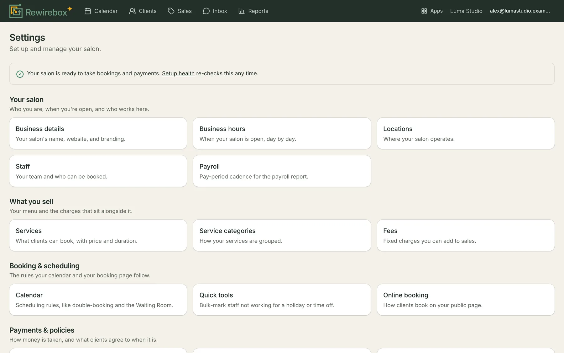 The Settings hub: a line confirming the salon is ready to take bookings and payments, then grouped destinations — Your salon holding business details, business hours, locations, staff and payroll; What you sell holding services, service categories and fees; Booking and scheduling holding calendar, quick tools and online booking; and Payments and policies beginning below the fold.