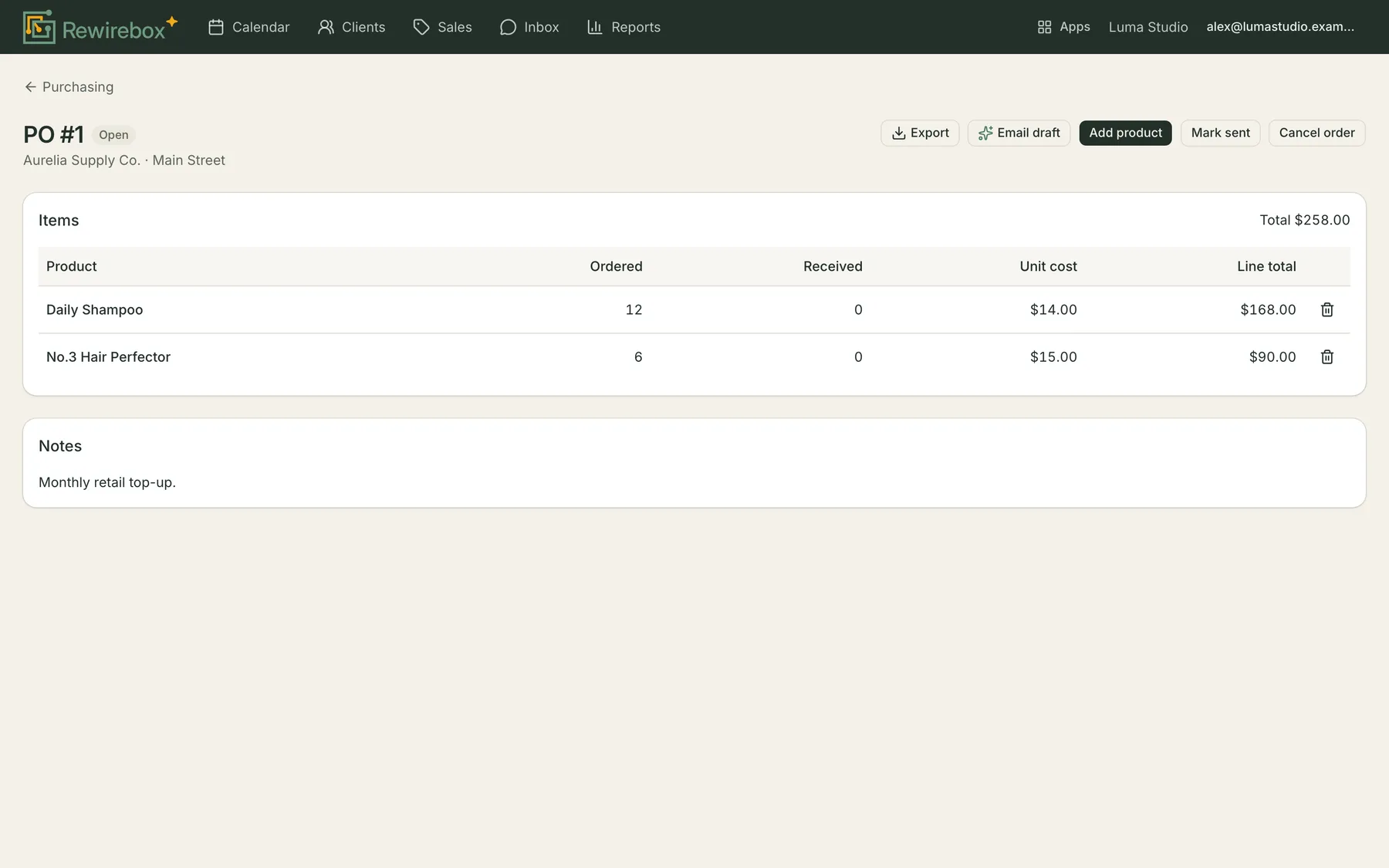 An open purchase order: the supplier and delivery location, then a table of ordered products with quantity ordered, quantity received, unit cost and line total.