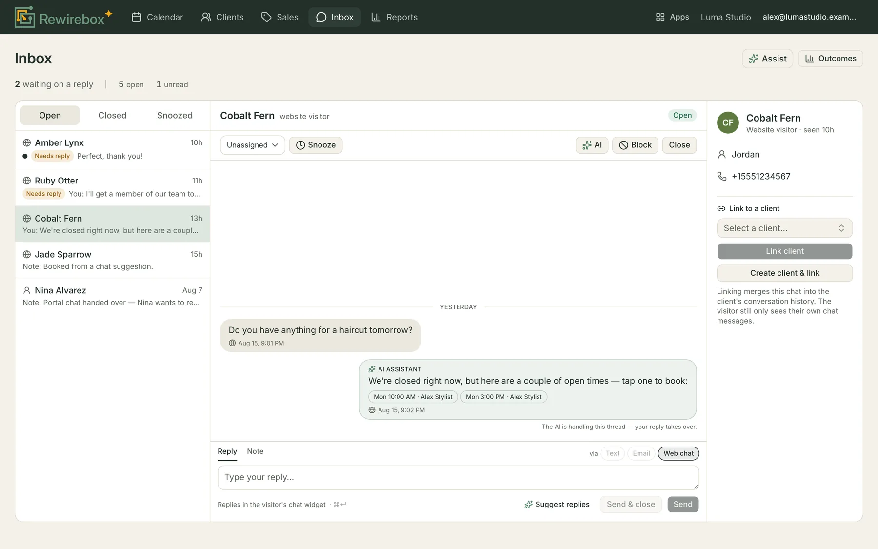 The Inbox with a web-chat thread open: five conversations in the list, the visitor Cobalt Fern's question about a haircut, an AI assistant reply offering two tappable times with a stylist's name, and a right-hand rail holding the phone number they shared and a Link to a client control.